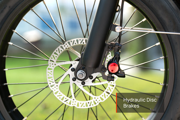 Folding three-wheel electric bike with hydraulic disc brakes for responsive and safe stopping
