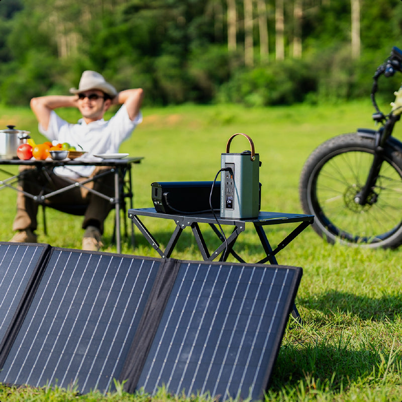 Solar panel kit with inverter supporting off-grid energy needs for camping in scenic highland meadows