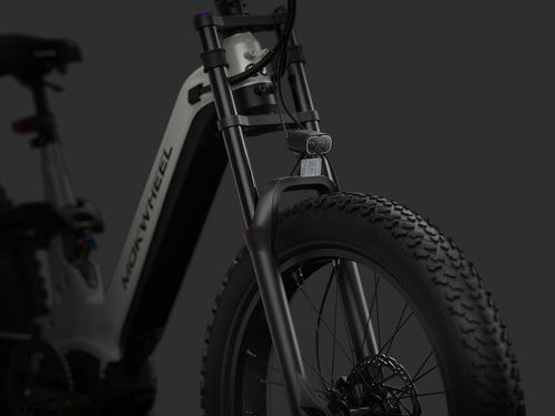 Dual-crown long-travel suspension offering strong impact absorption and precise stability for aggressive off-road riding