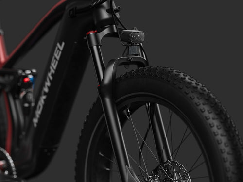 130mm front suspension system easily handles rough terrain, enhancing obstacle clearance and riding stability — Mokwheel electric bike.