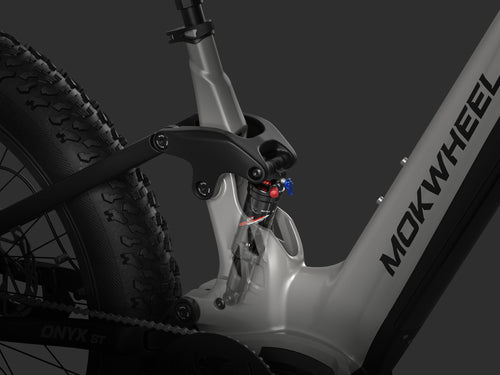 Rear suspension with DNM 50mm mid shock designed to absorb bumps and impacts on rocky and uneven trails