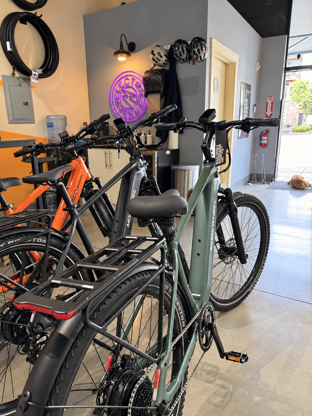 Close view of Mokwheel e-bikes near the store entrance.