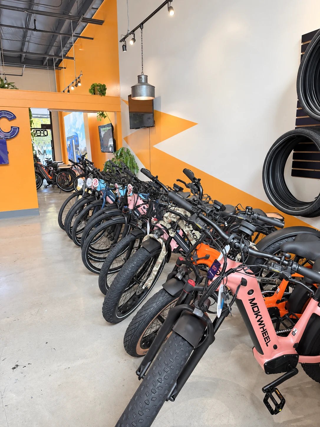 Mokwheel e-bikes lined up on the Tualatin shop floor